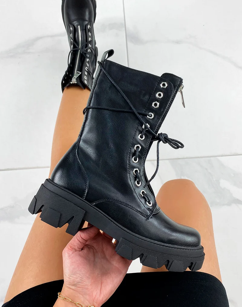Bottines hautes noires à zip argentée
