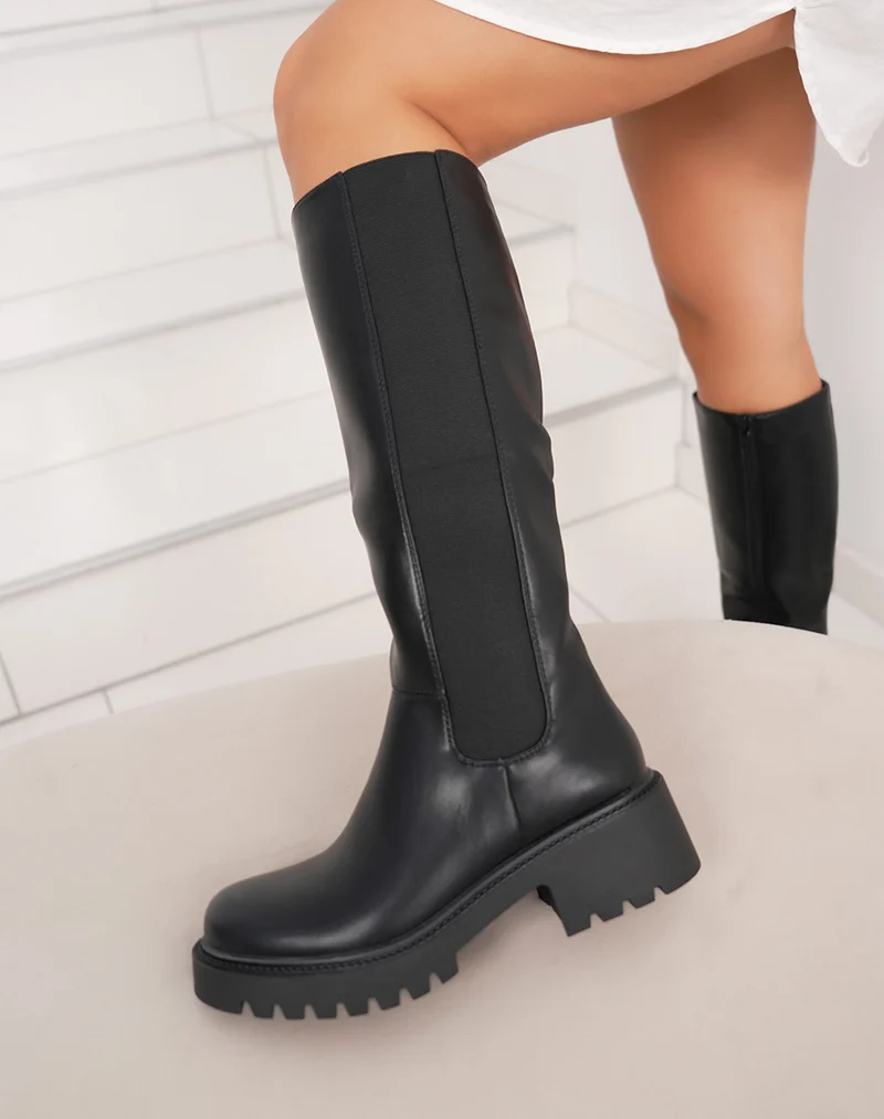 Bottes noires à semelle crantée et élastique latéral