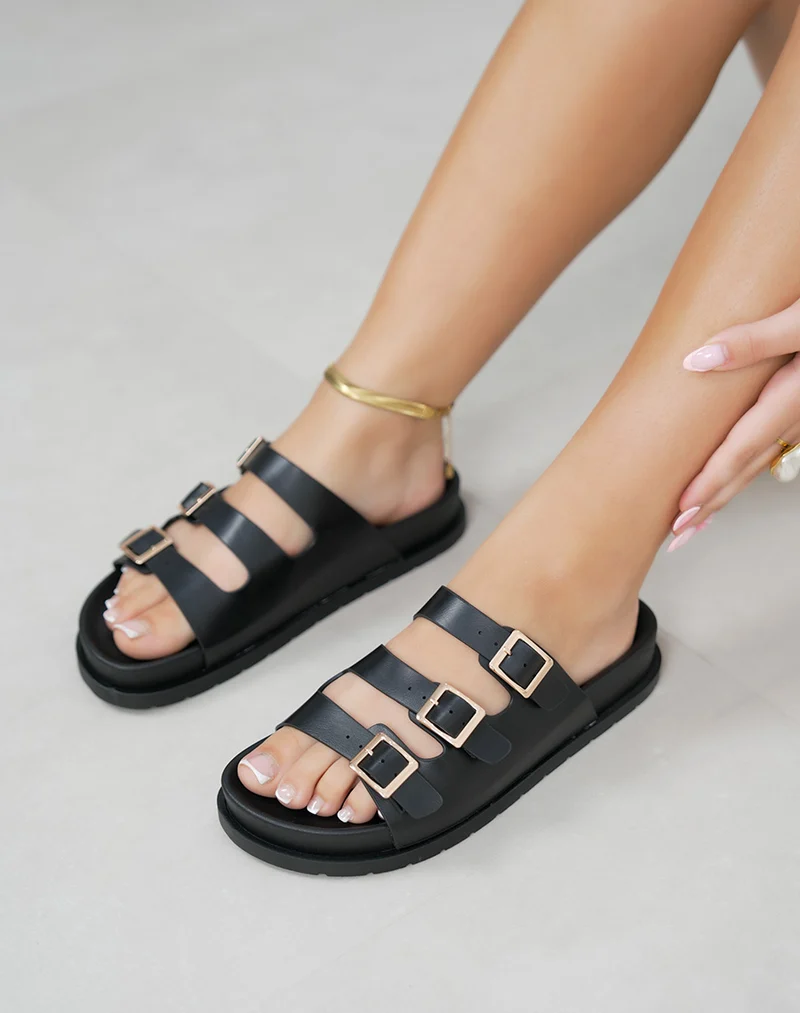 Mules femme noires tendance à brides fines et boucles dorées confortables