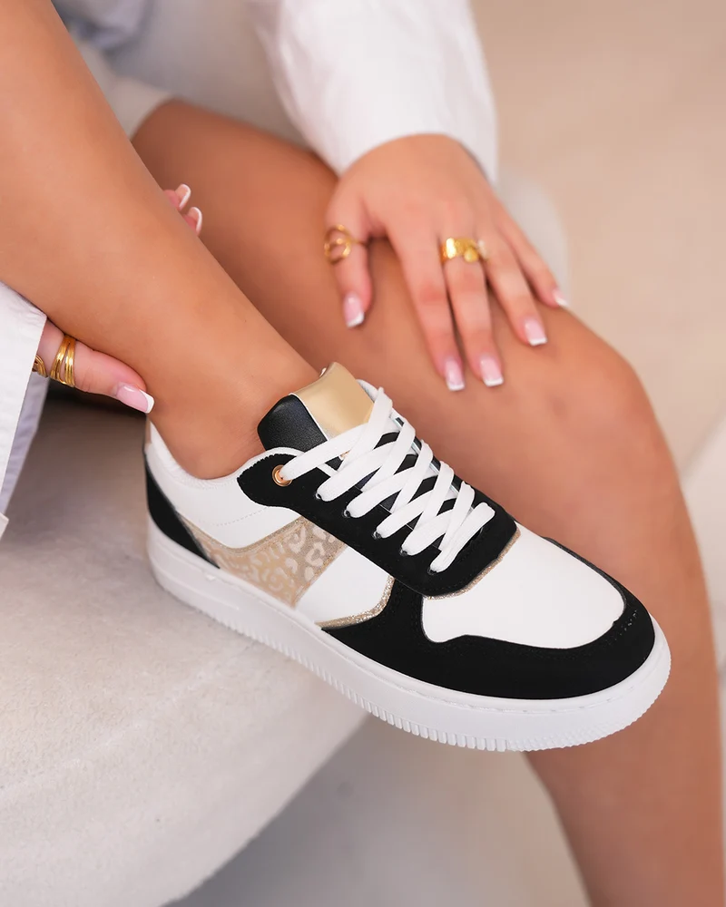 Basket femme blanche et noire tendance avec détail léopard doré