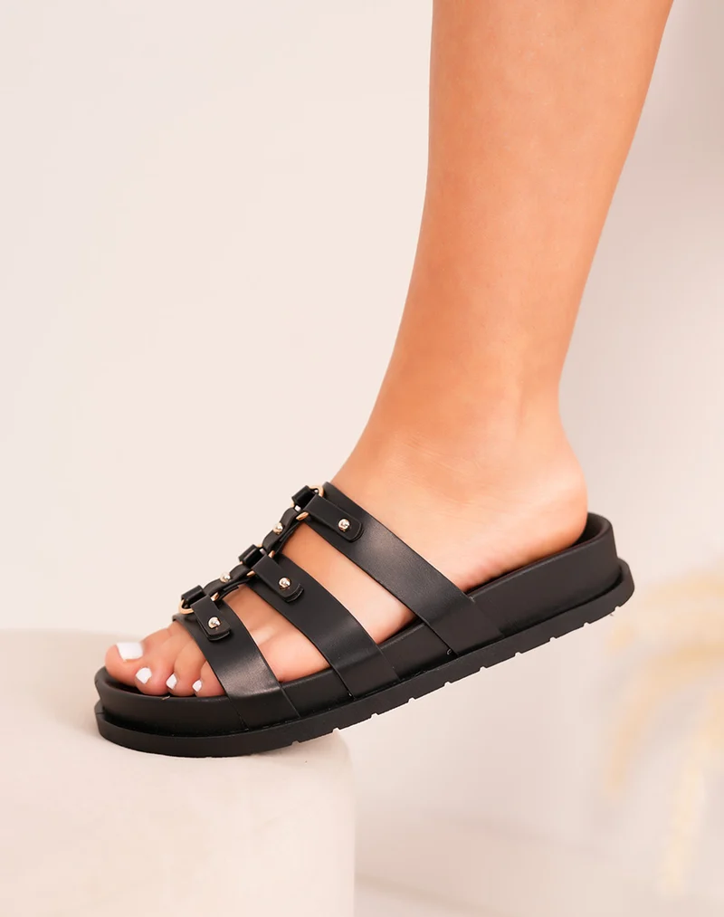 Mules femme noires élégantes à brides avec détails dorés et plateforme confortable