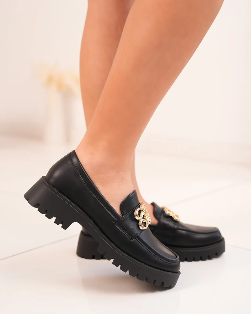 Mocassins femme noirs avec motif doré et semelle crantée