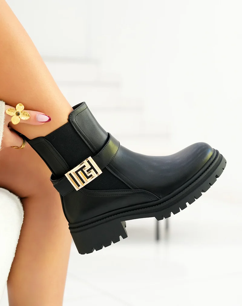Bottines femme noires avec boucle dorée géométrique et semelle crantée