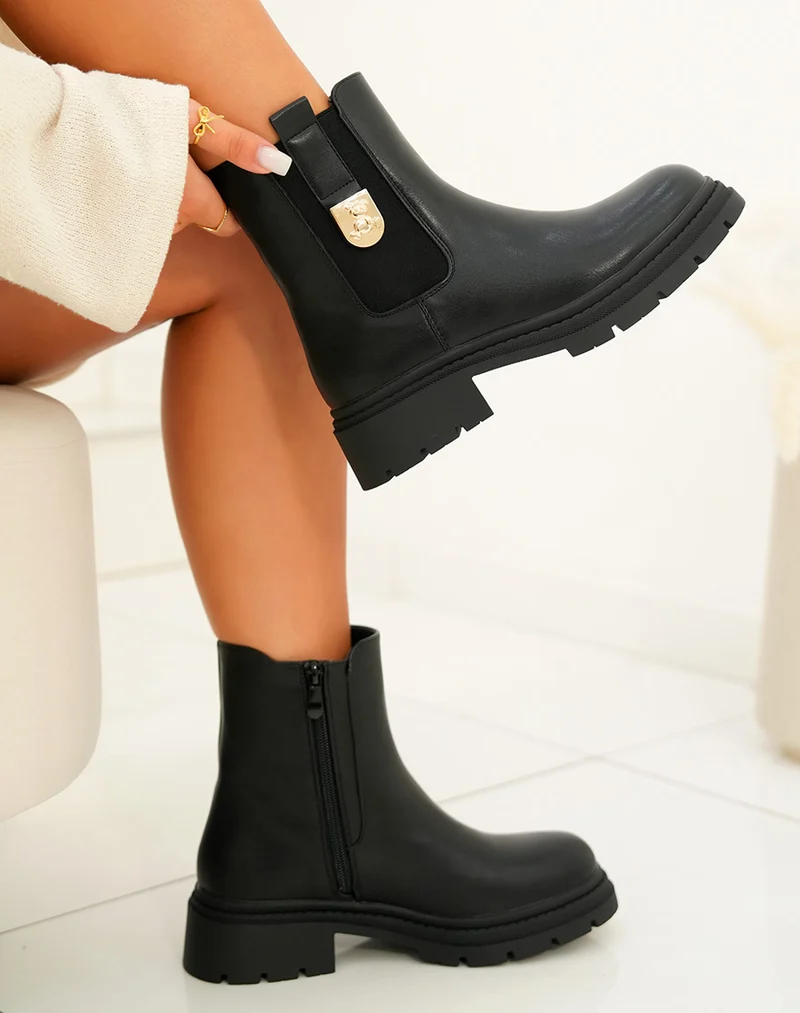 Bottines femme noires avec détail ourson doré et semelle crantée