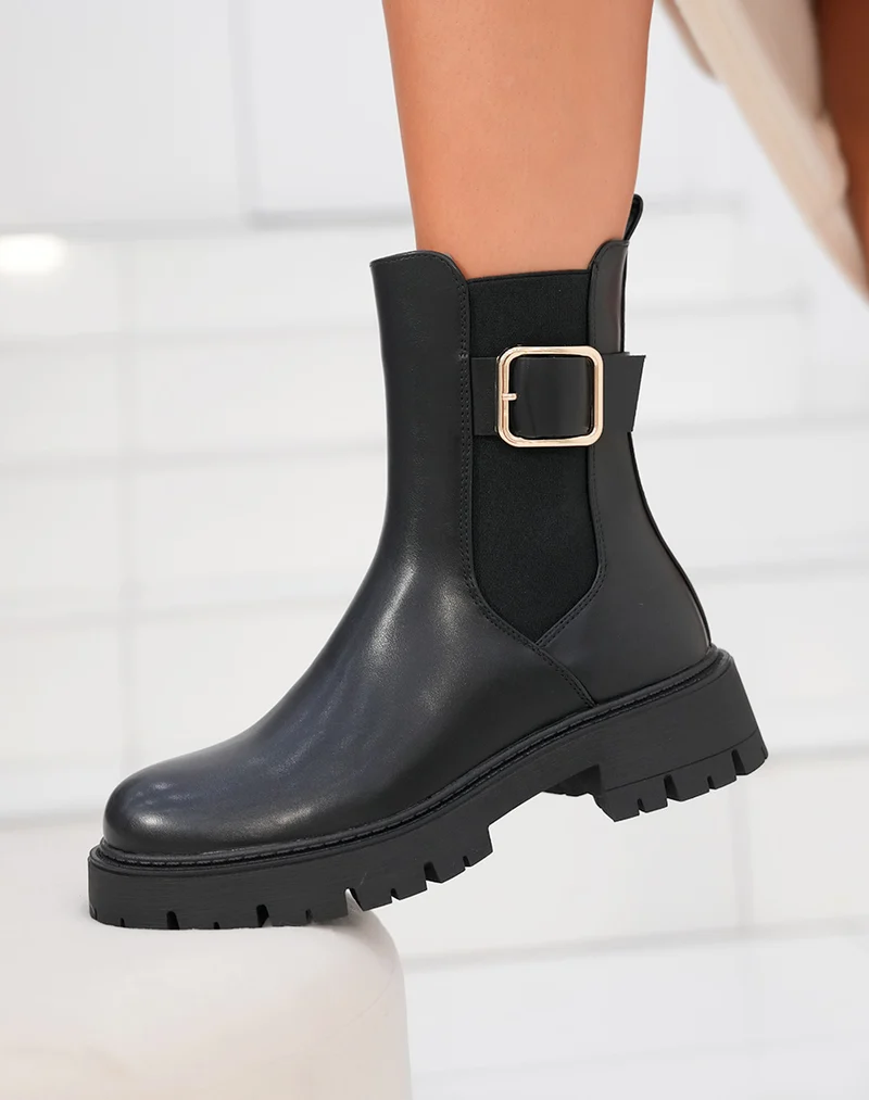 Bottines femme noires style Chelsea avec boucle dorée et semelle crantée