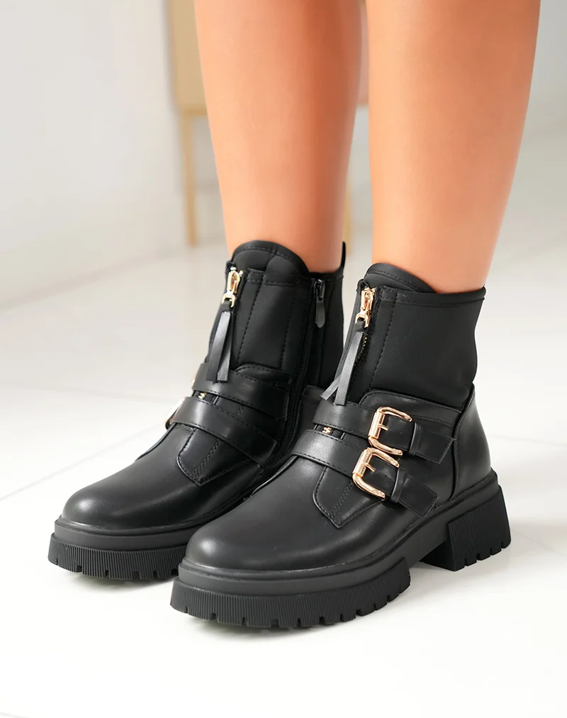 Bottines noires: Zippé et détails dorés