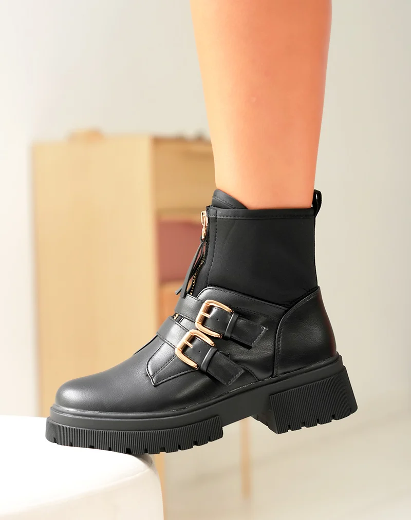 Bottines noires: Zippé et détails dorés