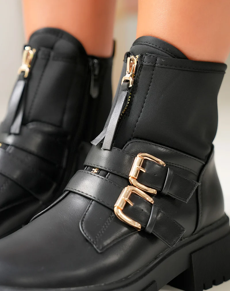 Bottines noires: Zippé et détails dorés