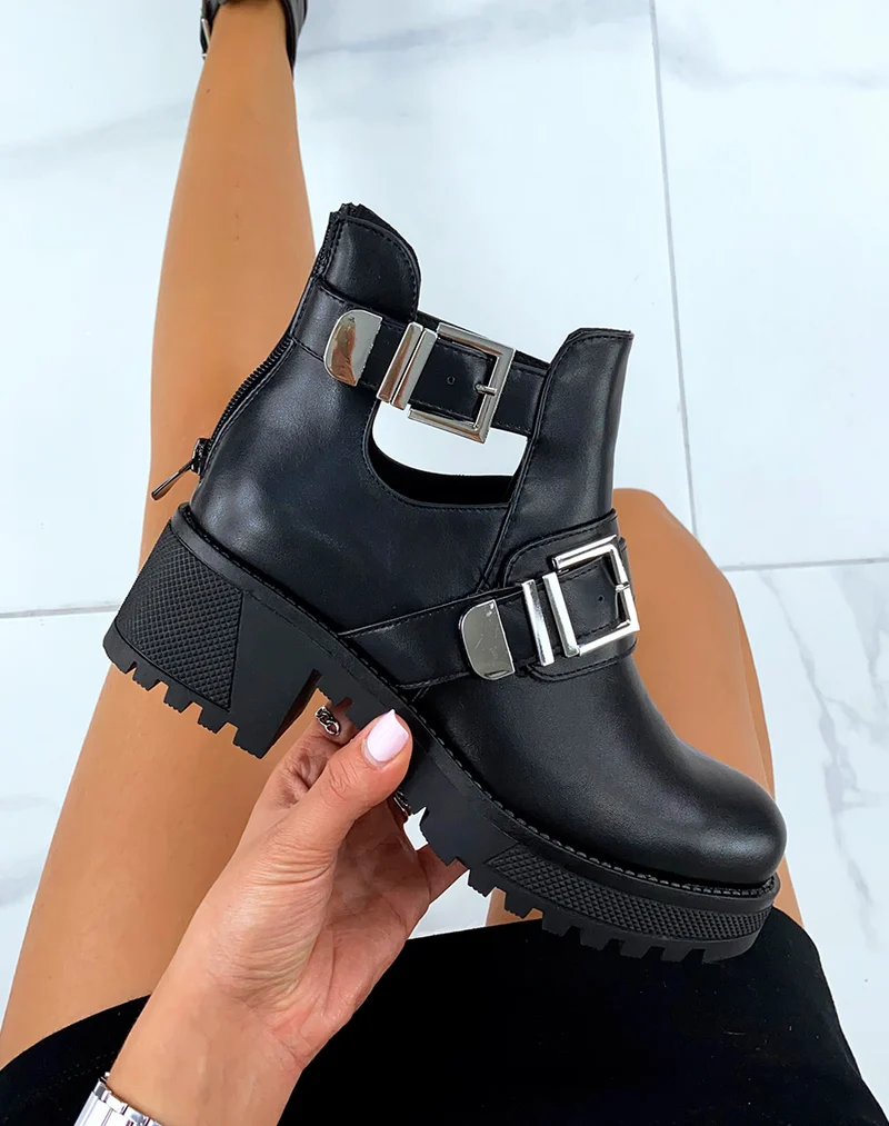 Bottines noires à semelles crantées et doubles brides