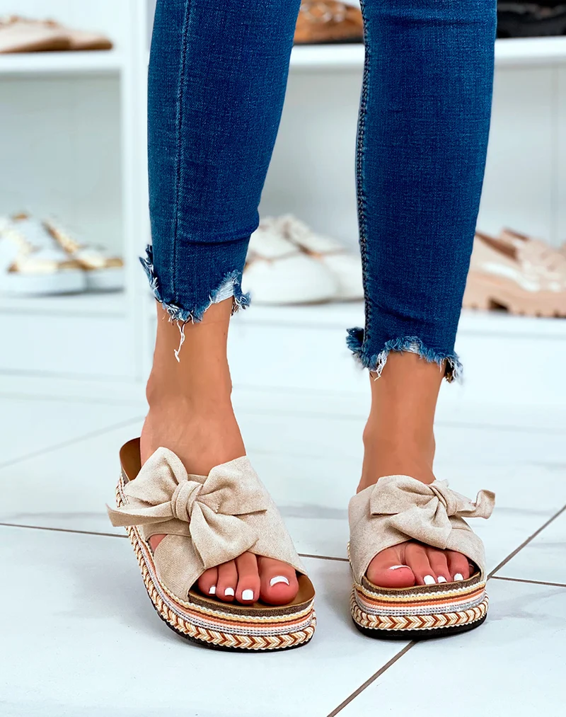Mules à plateforme en suédine beige à gros noeud