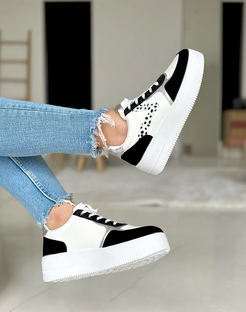 Baskets noires et blanches avec motifs dalmatien et détails argentés