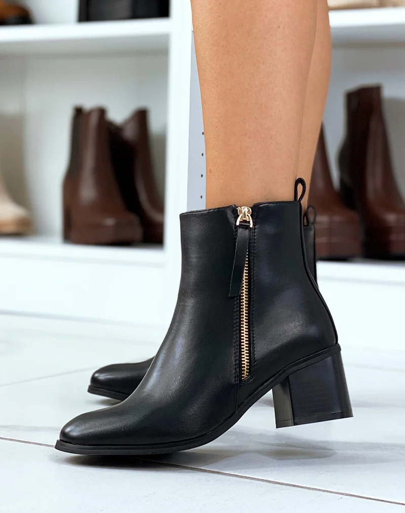 Bottines noires à zip doré et petit talon