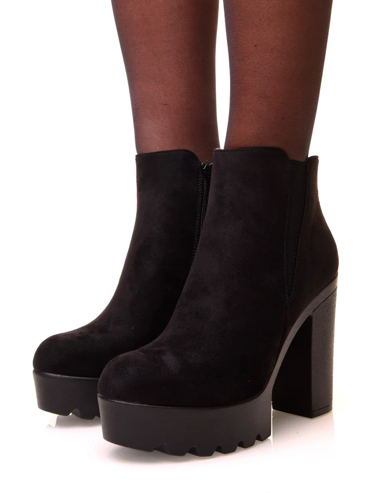 Bottines noires en suédine à talons et élastique échancré