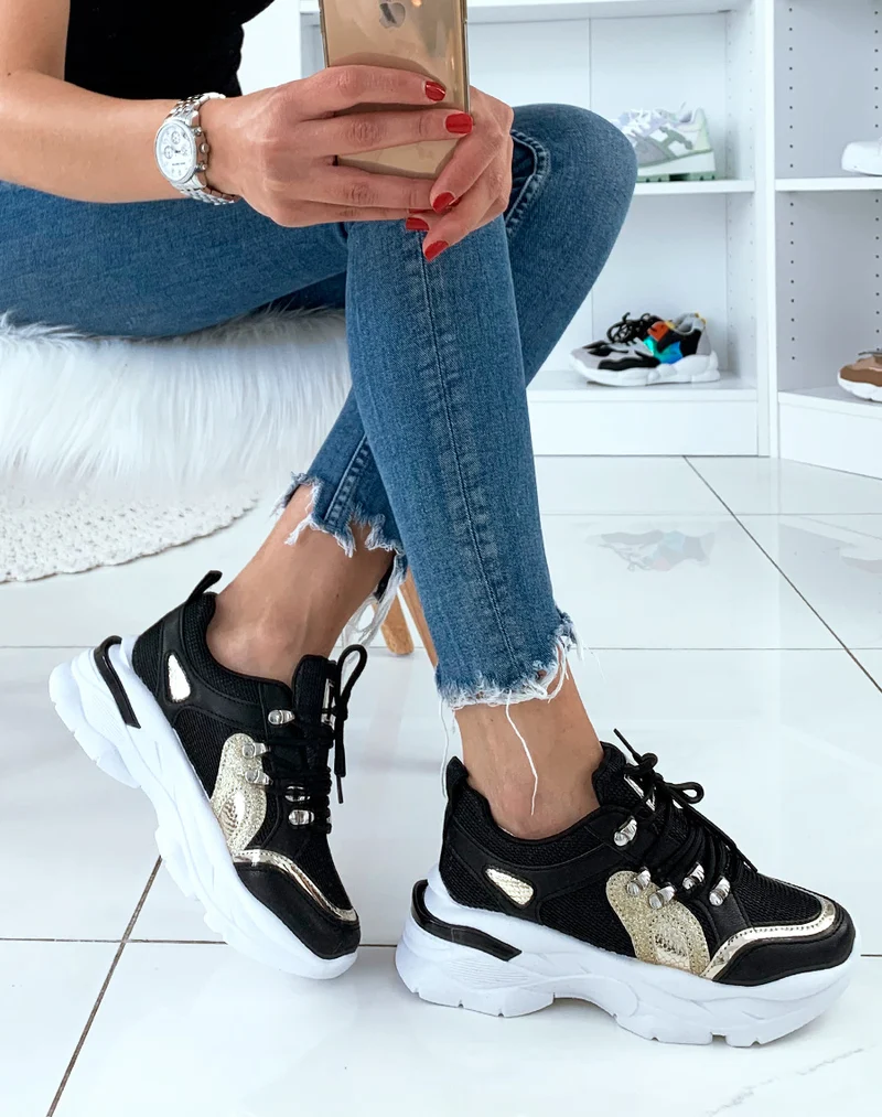 Baskets noires à empiècement doré et bande sur talon