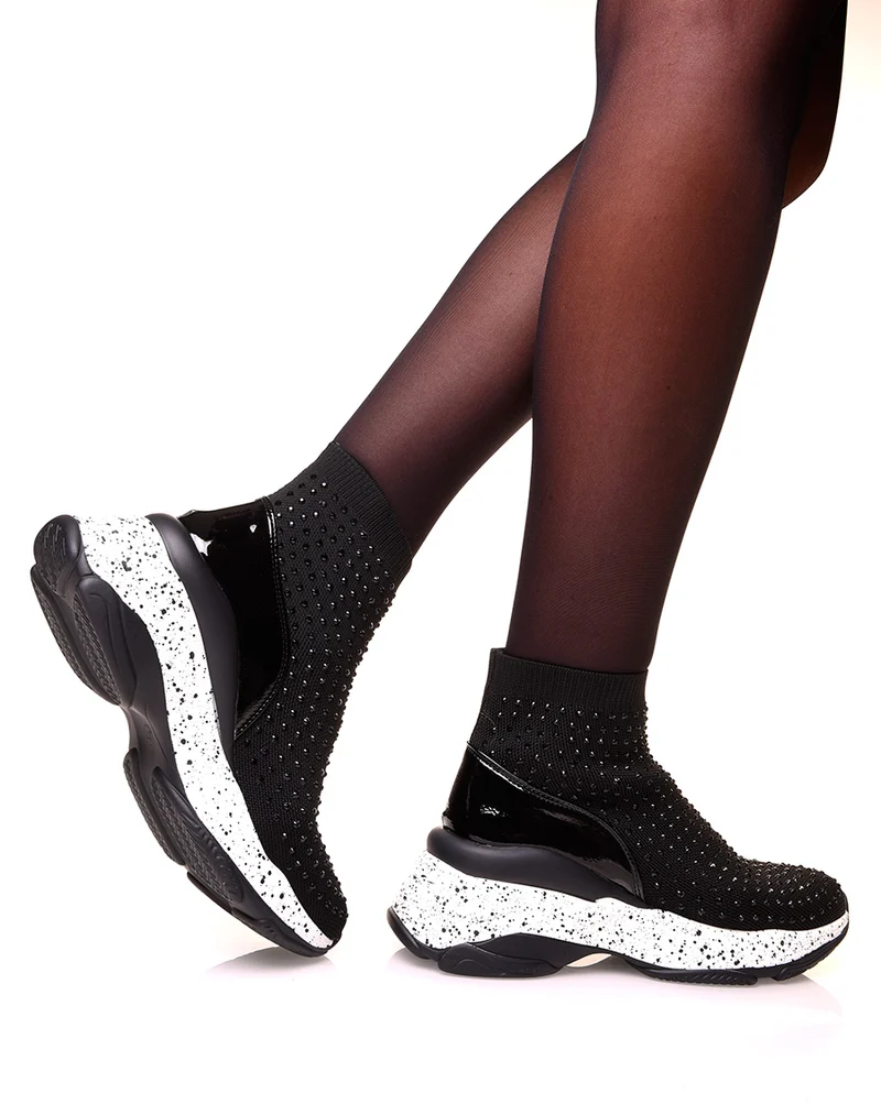 Baskets noires en forme de chaussette à semelles tachetées