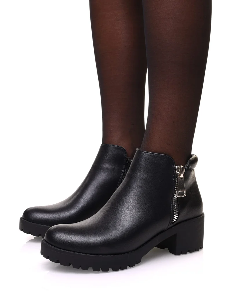 Bottines noires à fermeture éclair décorative et talon mi haut