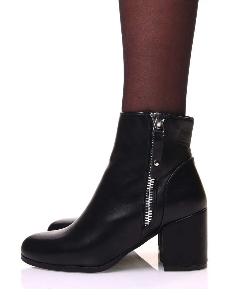 Bottines noires à talon et fermeture argentée sur le côté