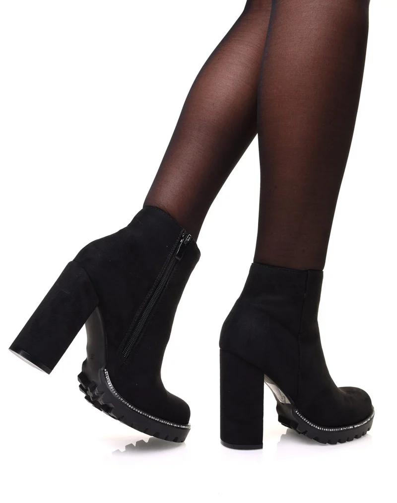 Bottines noires en suédine à talon et semelle crantée