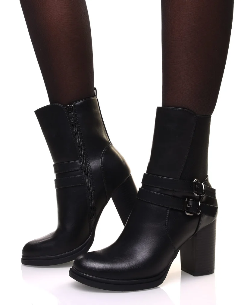 Bottines noires montantes à talons à sangles