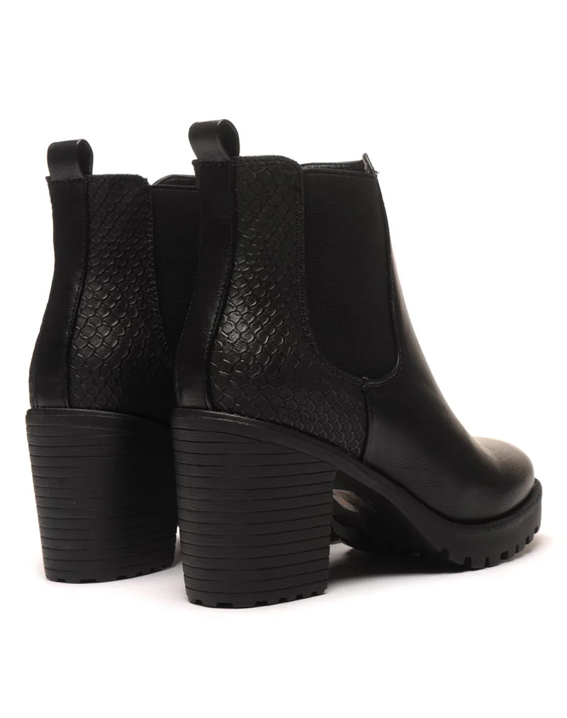 Bottines crantées noires imprimés python