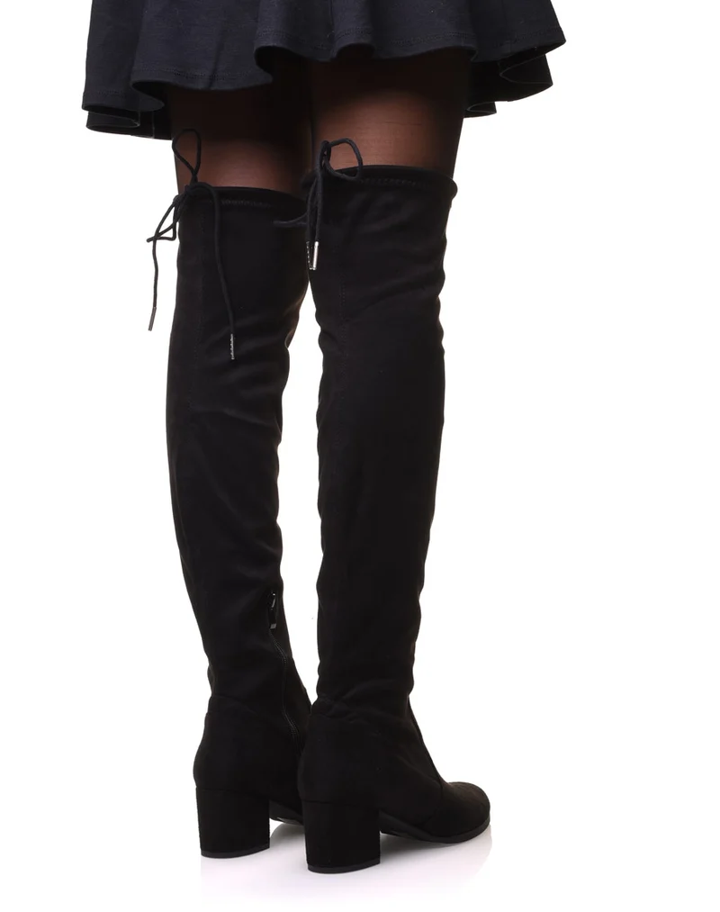 Cuissardes noires en suédine à talons mi hauts