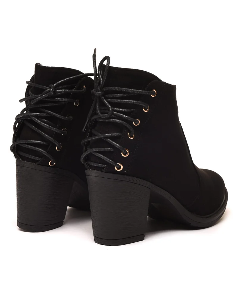Bottines plates noires suédine à forme santiag